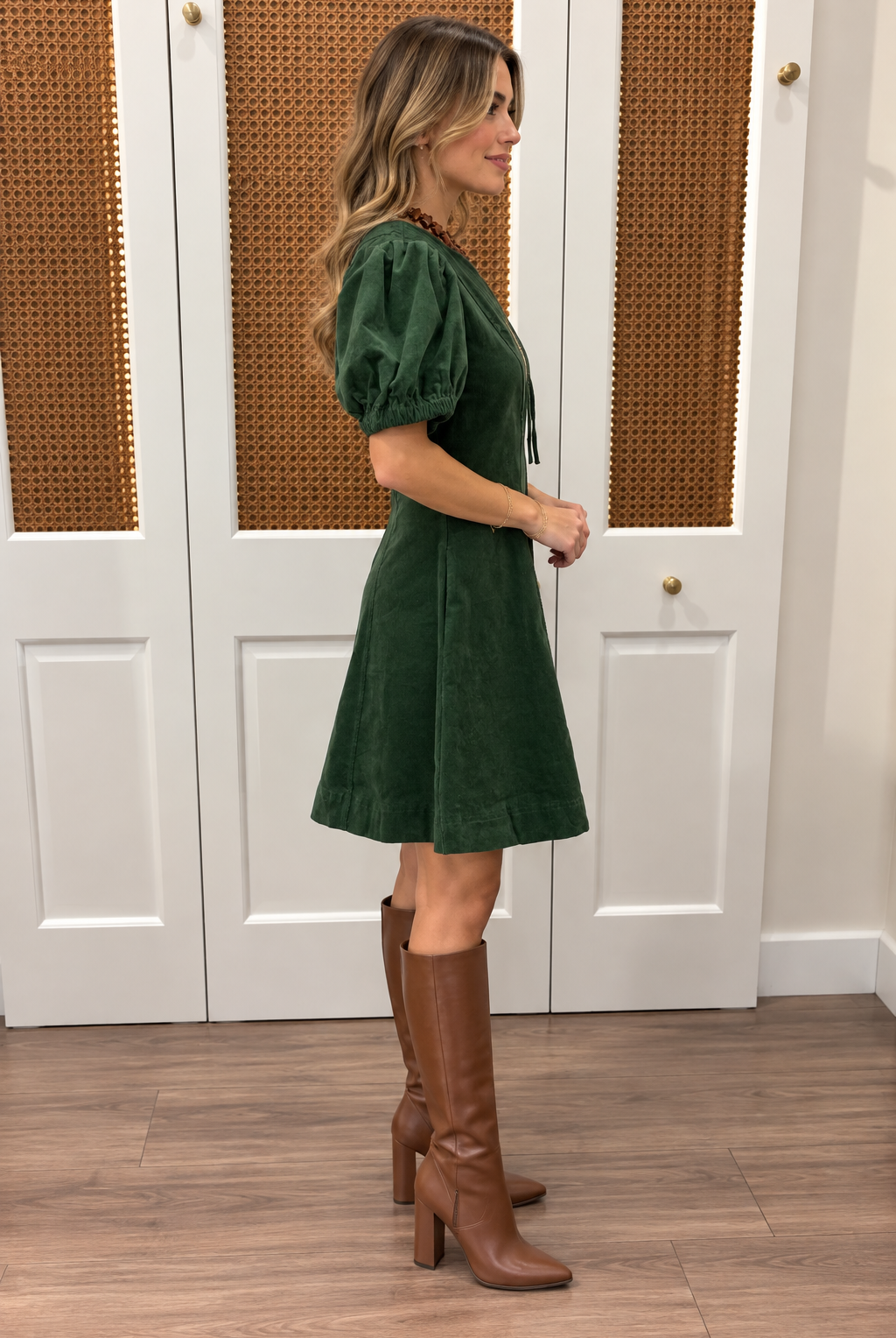 Millie Dress by Entro — forest green corduroy mini dress with zip-front V-neckline, puff sleeves, and A-line skirt, side view Style #D32169