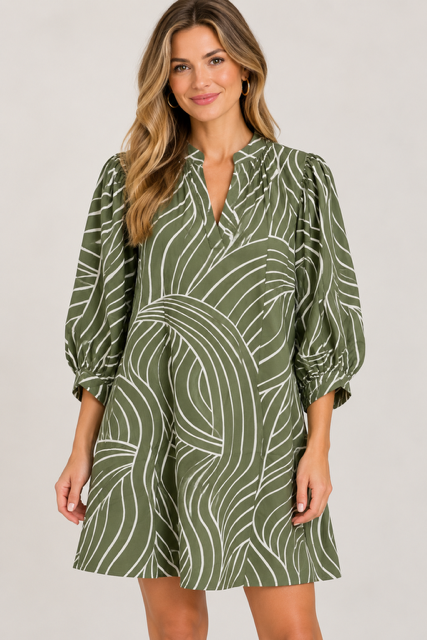 Susan Dress by Entro in olive with a curved cream motif, split V neckline, and smocked cuffs, front view