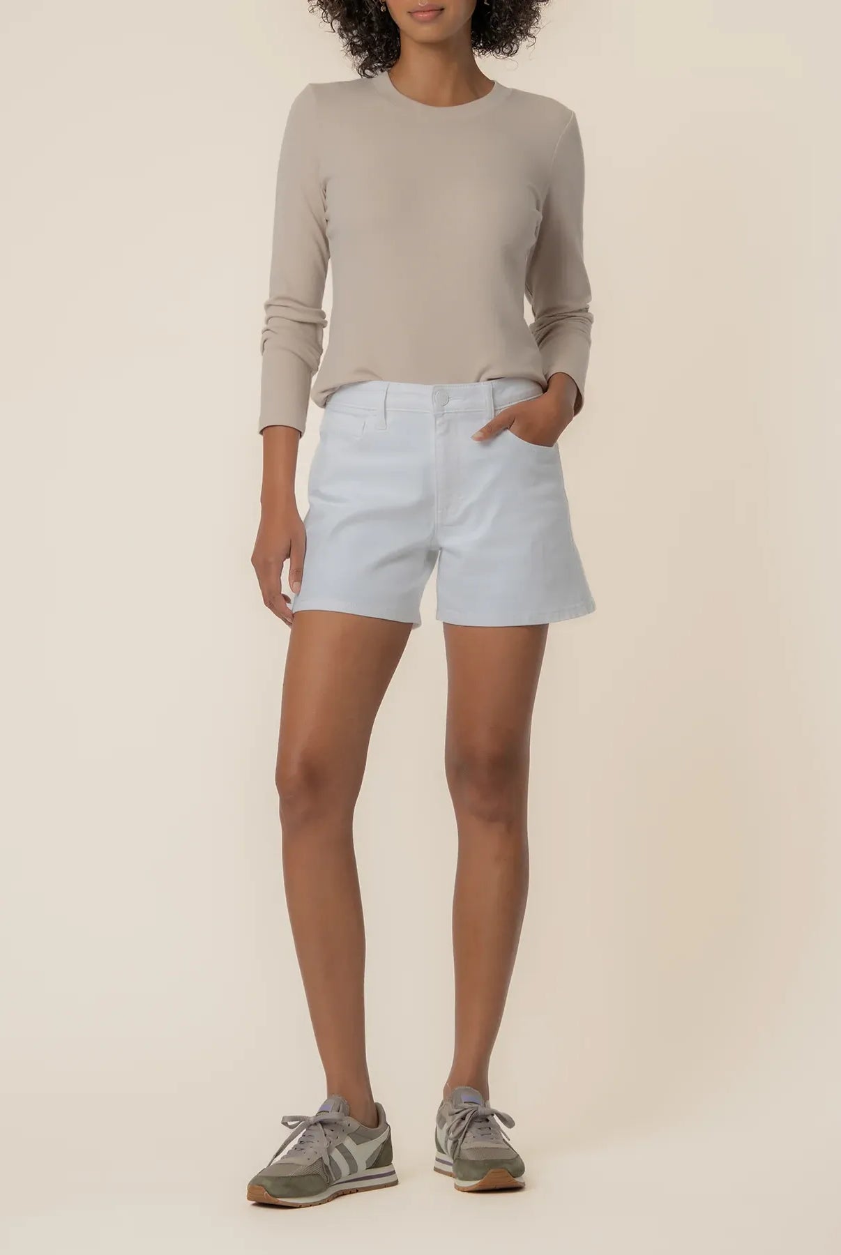 Jane high-rise jean shorts in optic white by Kut from the Kloth, shown on a model with a casual fit and distressed detailing.