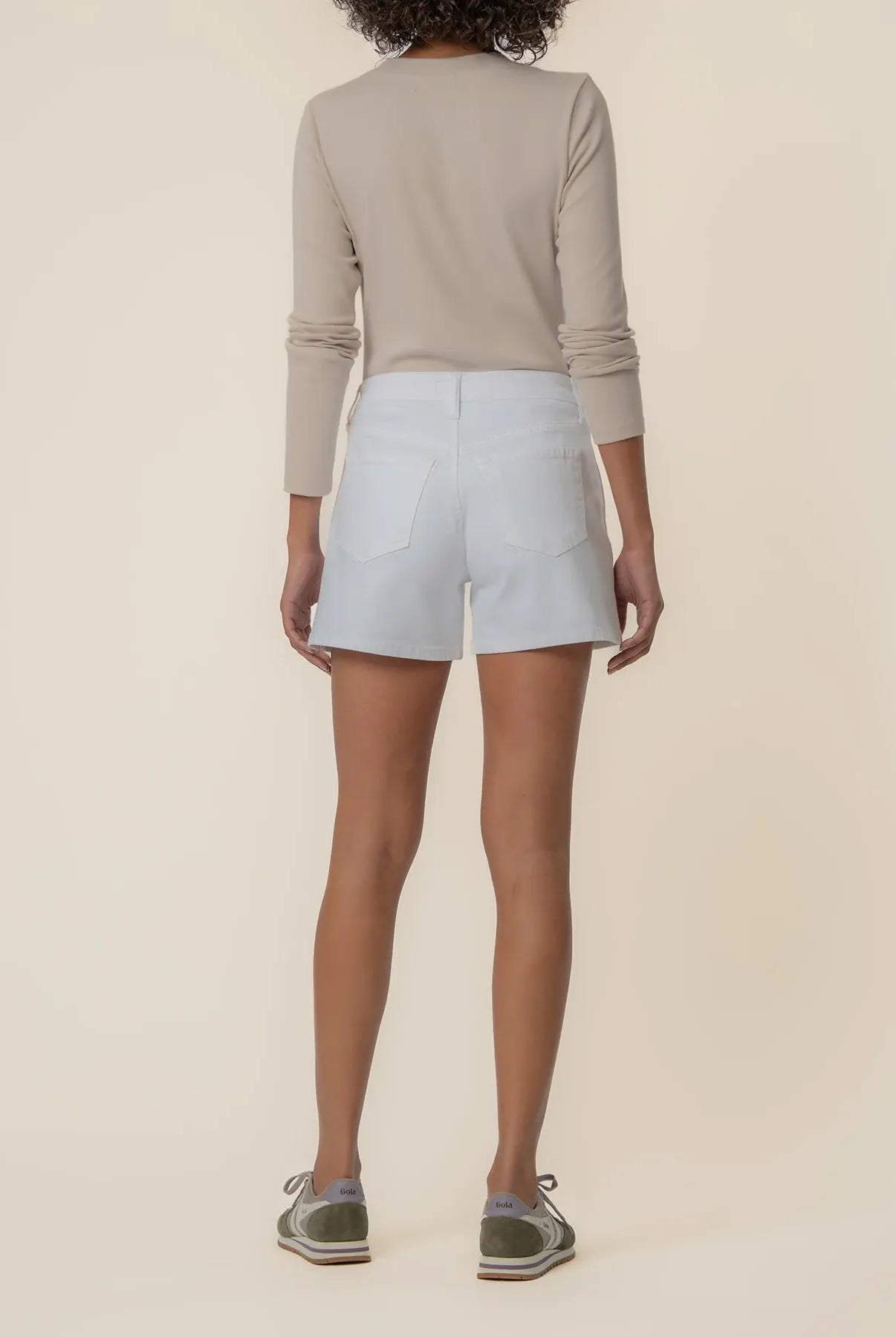 Jane high rise jean shorts in optic white by Kut from the Kloth, shown on a model with a close-up of the denim fabric and fit.