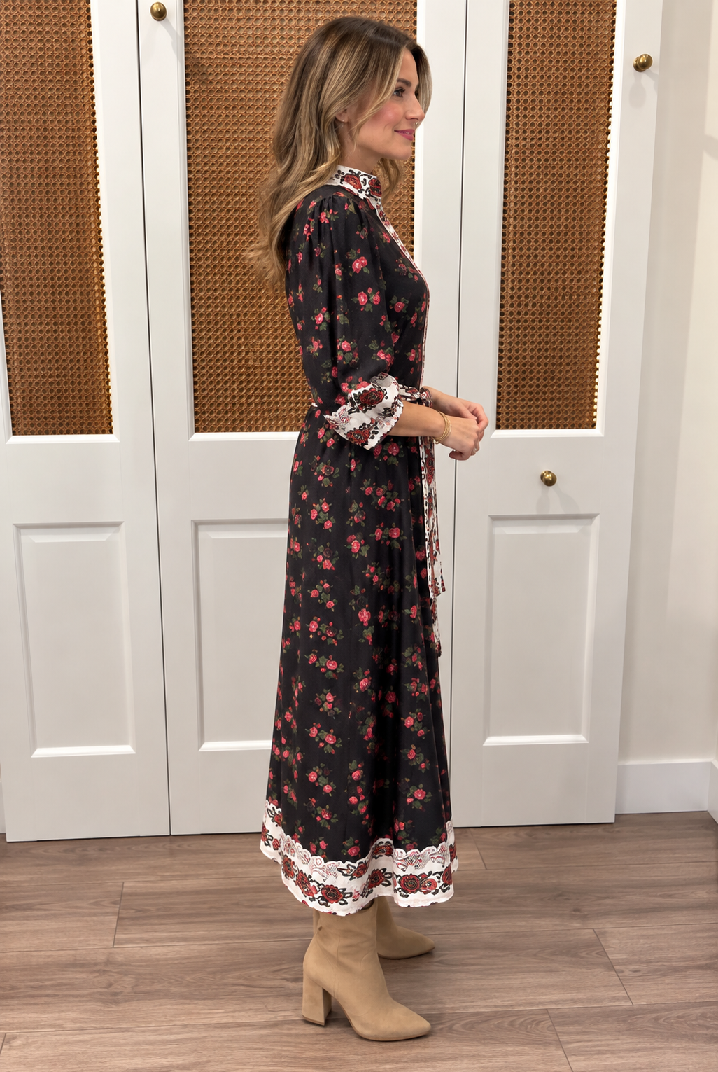 Brooks Dress by Smith & Quinn in Dream Garden — black rose print midi dress with A-line skirt and ivory border hem trim, side view