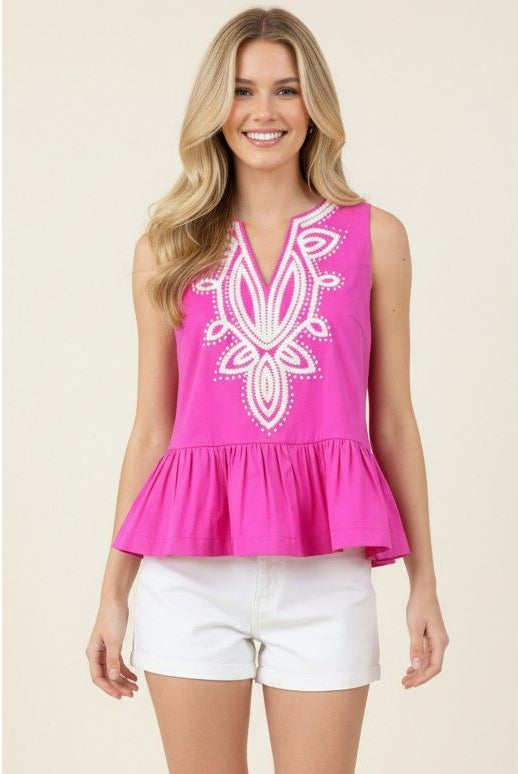 Tabby Top Pinch hot pink peplum close-up front, white medallion embroidery detail, split v-neck - Marj & Lizzie