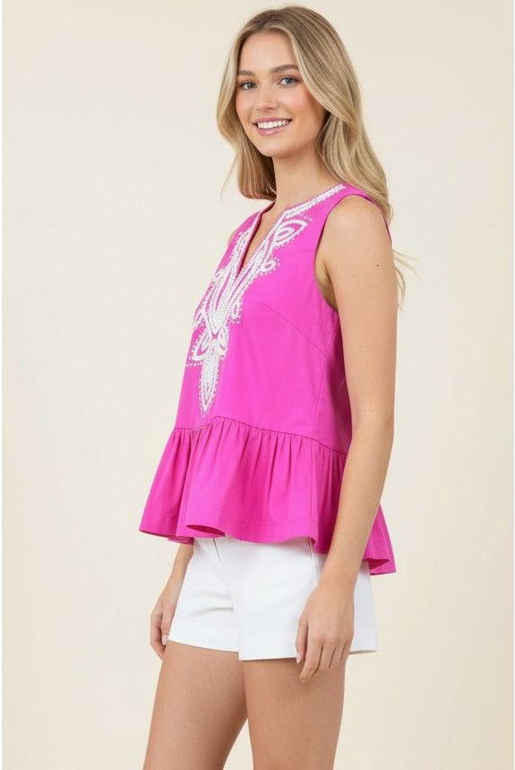 Tabby Top Pinch hot pink peplum side view, white medallion embroidery at neckline, sleeveless - Marj & Lizzie
