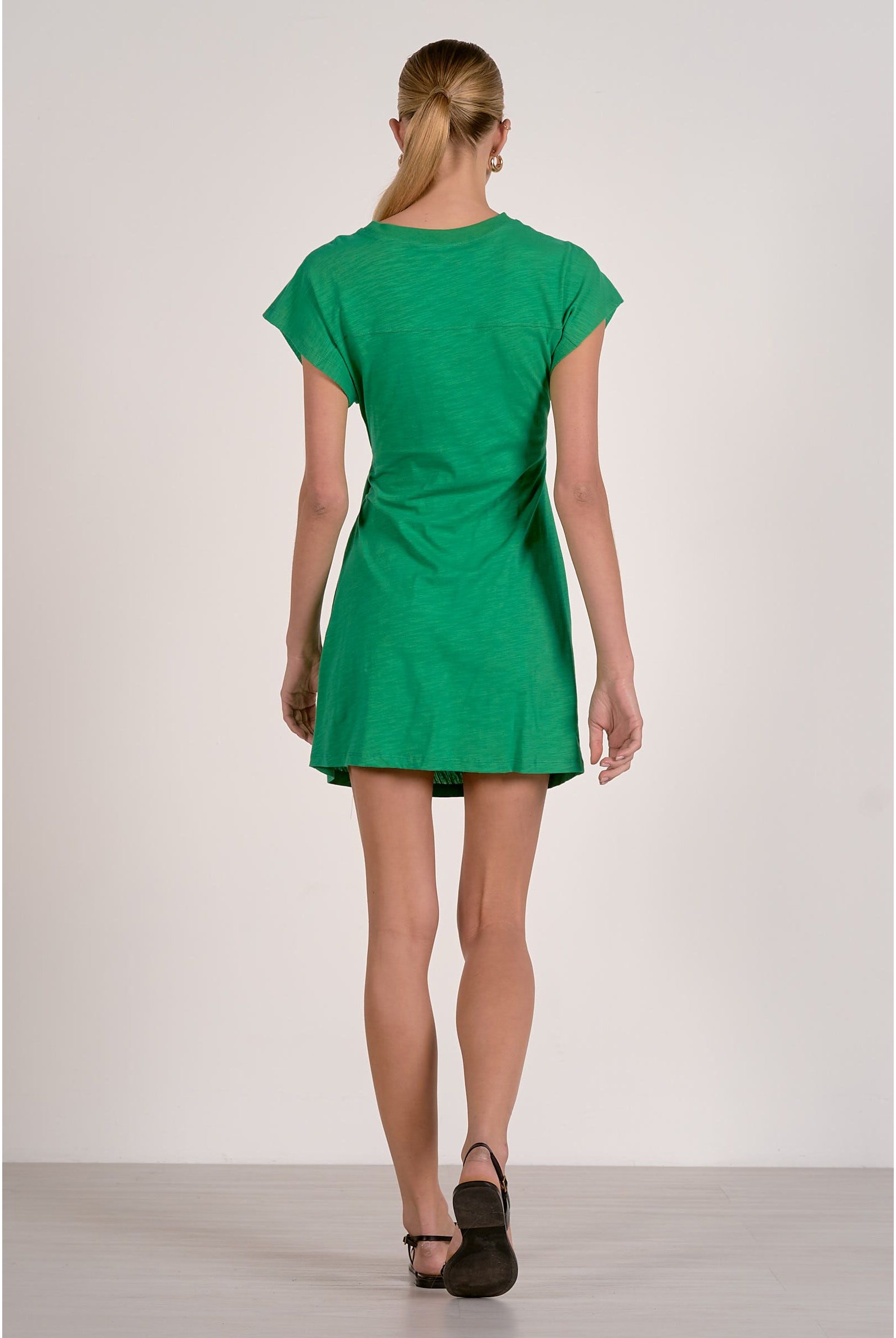Elan Kinsley Dress displayed on a mannequin, featuring a stylish design with elegant fabric and a flattering fit.