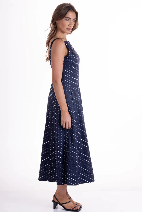 Orson Dress by Wyatt Wylde - navy polka dot sleeveless maxi dress, side view showing full skirt
