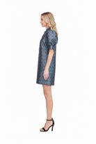  Georgia Dress by Jade in Gilded Trellis, front view, blue and gold metallic trellis jacquard, stand collar V-notch neckline trimmed in navy, puff sleeves, A-line shift silhouette