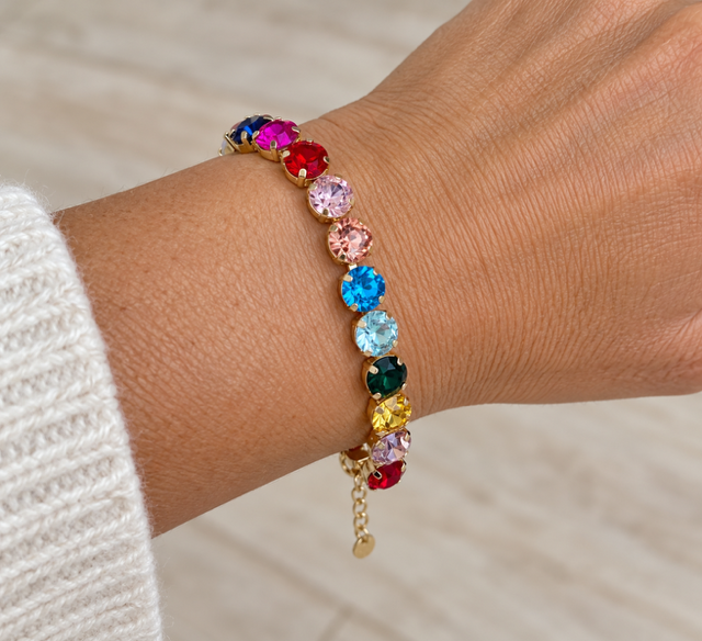 Rainbow Rhinestone Bracelet by Marj & Lizzie, multicolor rhinestones in gold bezels with extender chain, worn on wrist