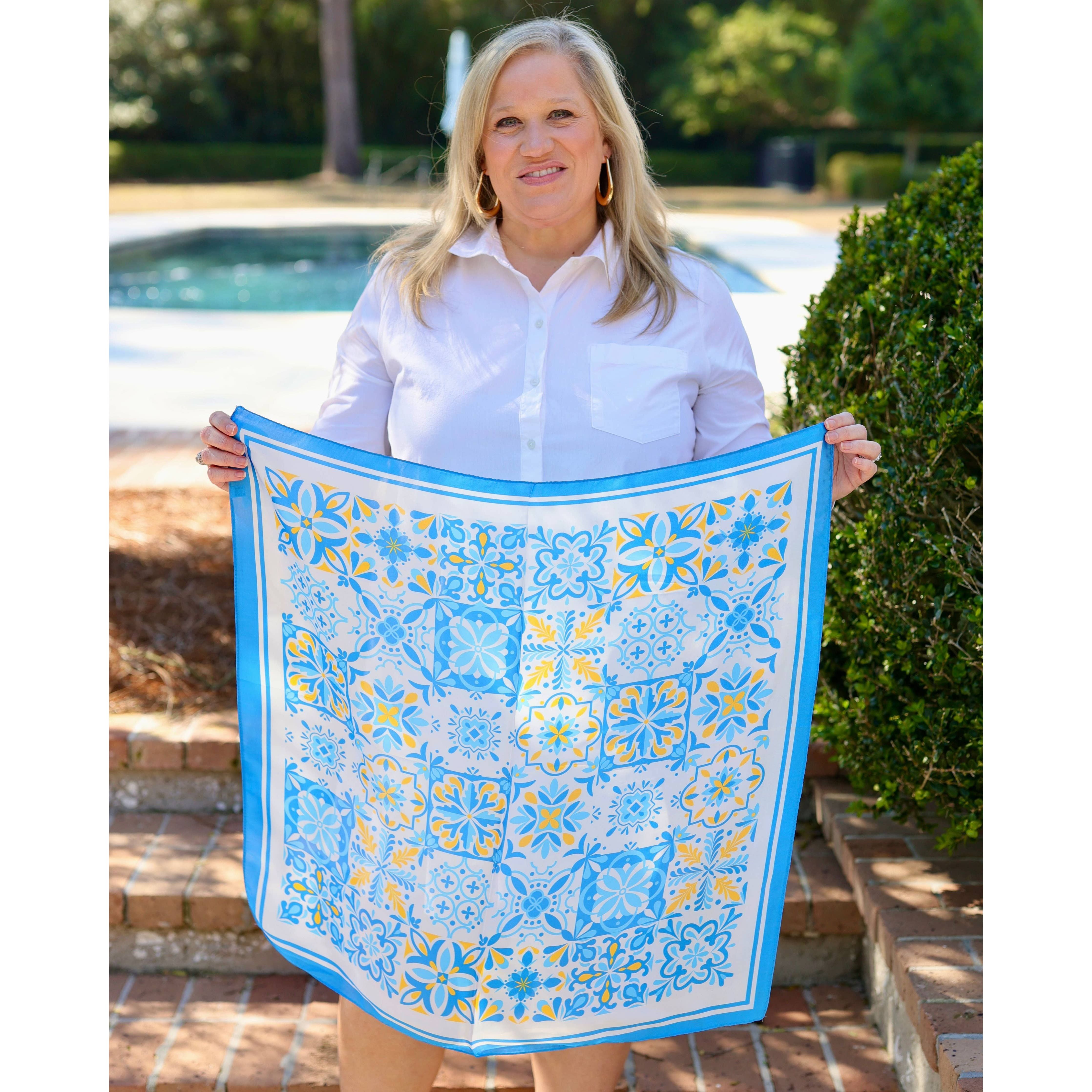 Blue Sorrento Mosaic Print Scarf by Caroline Hill, stylish accessories with intricate mosaic design, shown draped on a model.