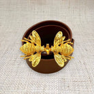 Garland Smooching Bees belt buckle featuring a detailed bee design on shiny metal surface.