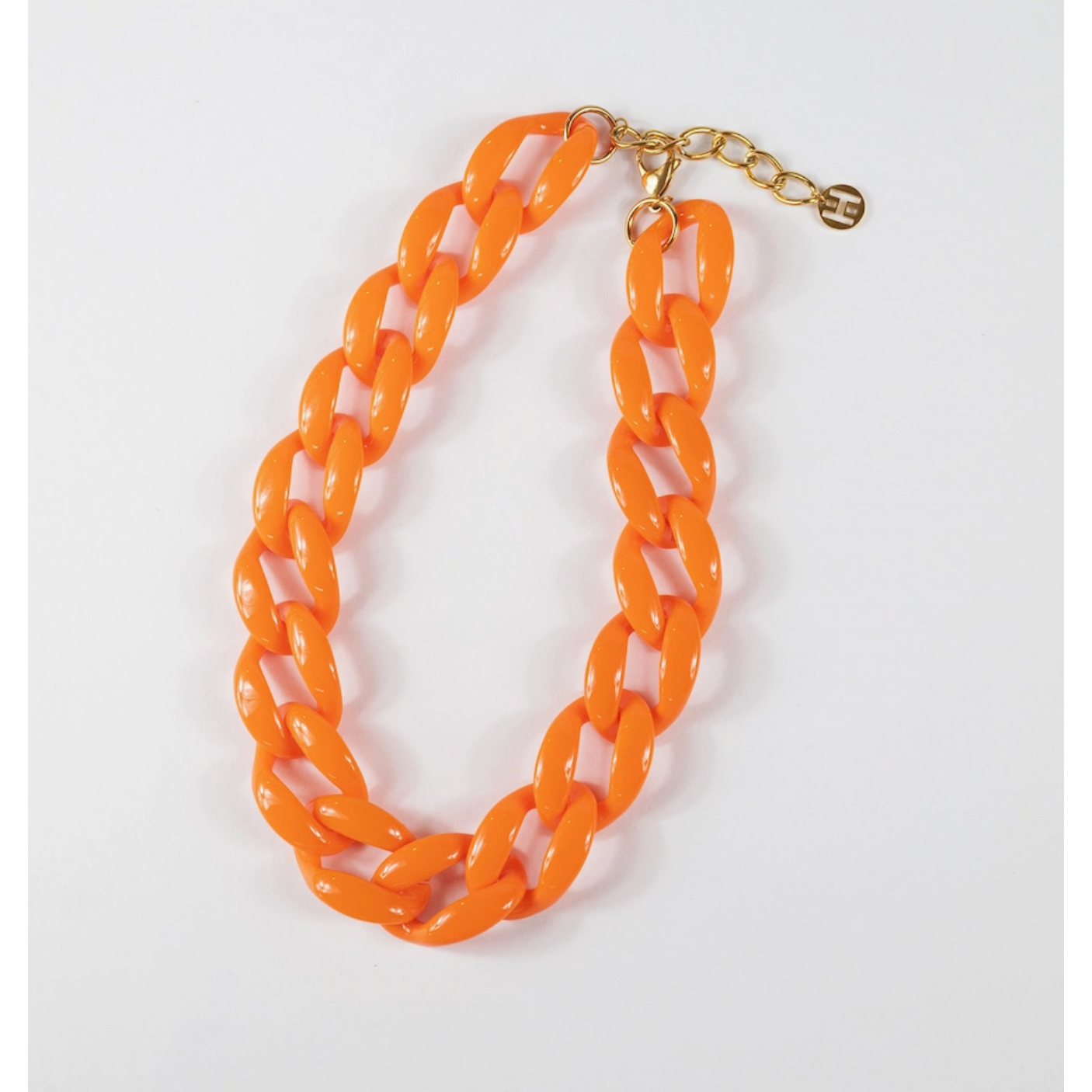 Orange chain necklace on a white background