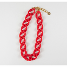 Red chain necklace with gold clasp on a white background
