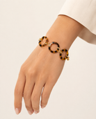 ali & bird jewelry tortoise resin link bracelet with gold-tone connectors, worn on wrist, side view 