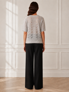 Another Love Amila Top in heather gray, short-sleeve pointelle openwork knit sweater, back view