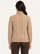 Kamaya Sweater by Another Love in Toasted Almond, back view showing allover cable knit, long sleeves, and ribbed hem