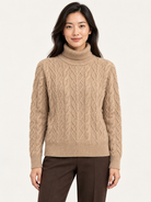 Kamaya Sweater by Another Love in Toasted Almond, front view showing cable knit, foldover turtleneck, and ribbed trim