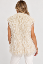 back view: Harlow Vest by Another Love in cream with allover fringe and a sleeveless silhouette, back view on model