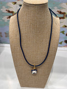 Aurora Pendant Necklace Navy by Smith and Co. Design — square crystal pendant on navy leather cord, gold accents