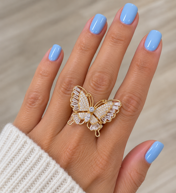Butterfly Ring by Marj & Lizzie, gold openwork butterfly with clear pavé stones, worn on hand