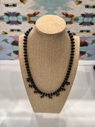 Beaded Bloom Necklace Navy by Smith and Co. Design — navy glass beads with CZ floral charms on marble