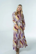 Briton Court Evelyn Maxi Dress in Desert Mirage abstract swirl print, wrap V-neckline with self-tie belt and tiered hem, front view