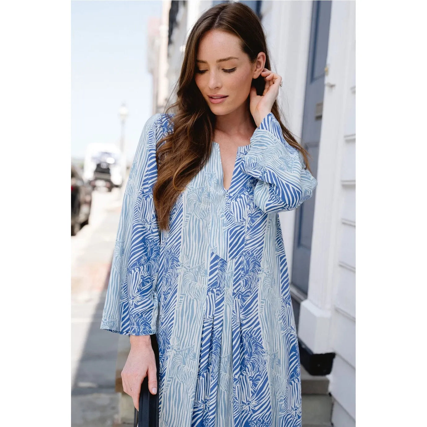Blue Kali Maxi Nantucket dress by Briton Court featuring a flowing silhouette and floral pattern.