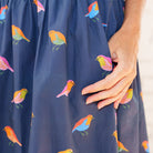 Caryn Lawn Sutton Skirt in navy bird print, multicolor bird print detail, side pocket close-up