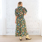 Caryn Lawn Sutton Skirt in olive duck print, gathered midi skirt, smocked waistband, back view with matching to
