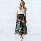 Caryn Lawn Sutton Skirt in olive duck print, gathered midi skirt, smocked elastic waistband, front view