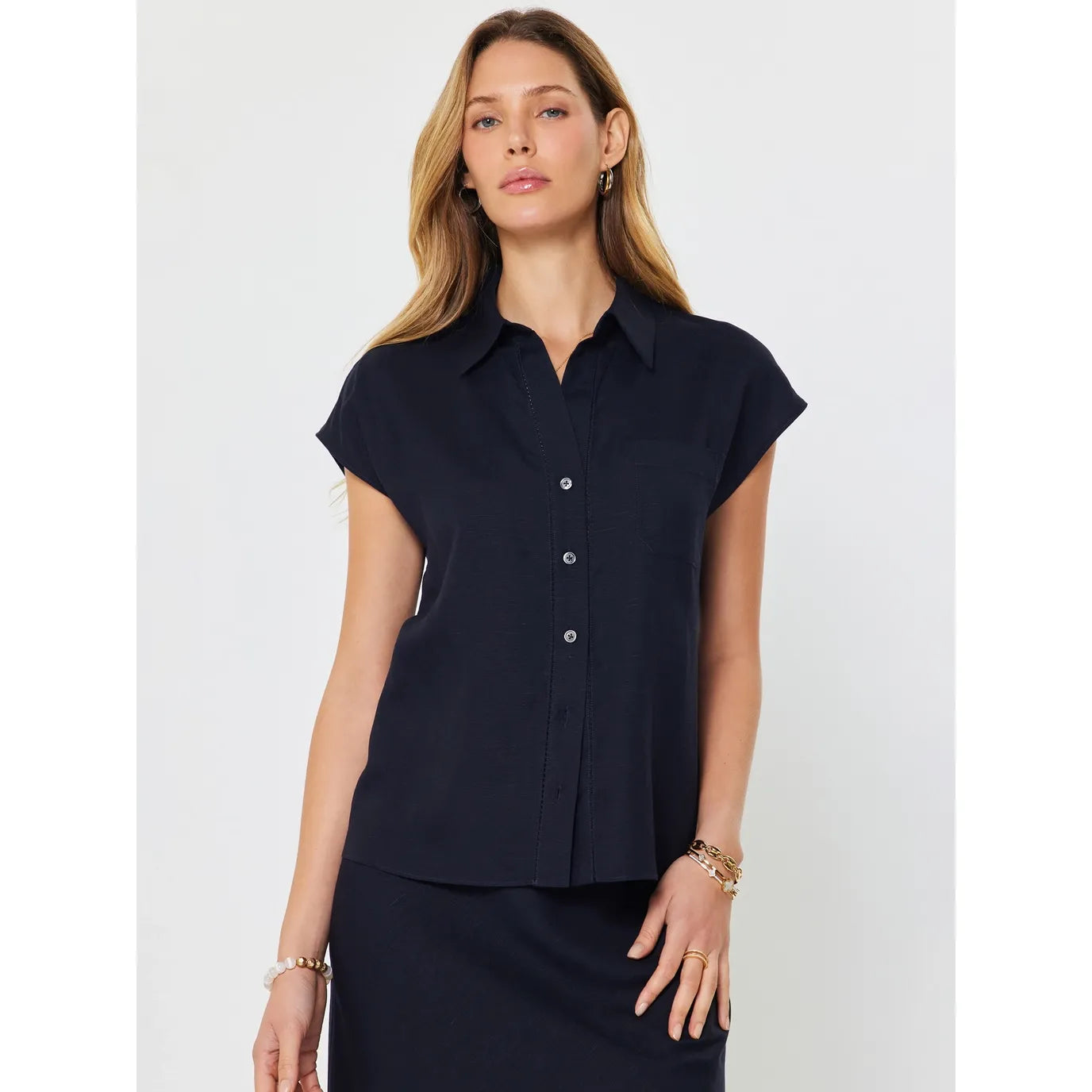 Current Air Lucy Ann top, a stylish button-down blouse with long sleeves, shown in a natural fabric and relaxed fit.