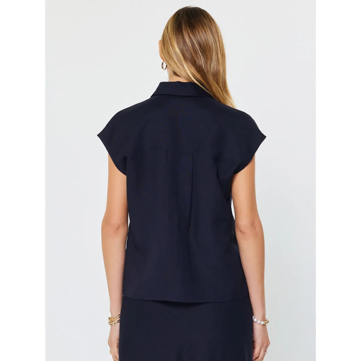 Navy blue Lucy Ann top by Current Air featuring cap sleeves and button-down front, shown from the back.