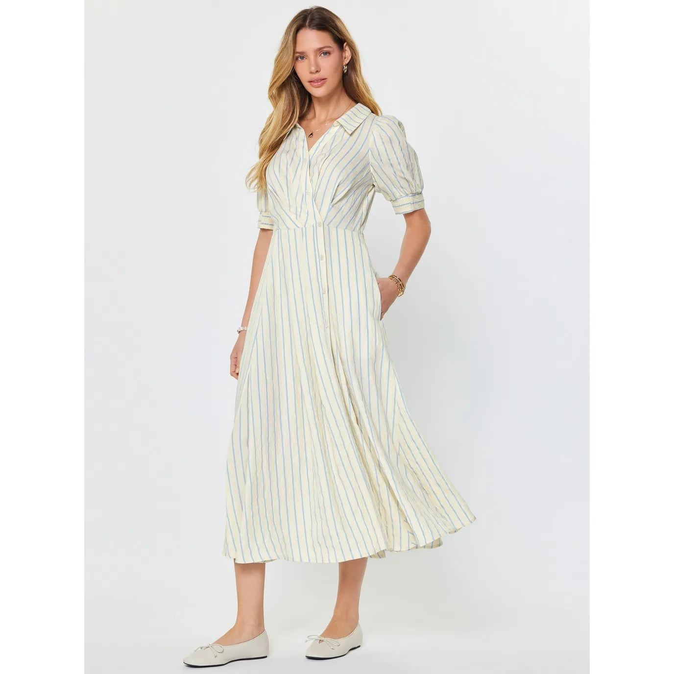 Current Air Petra Dress in ivory and blue, lightweight fabric with a relaxed fit, displayed on a hanger.
