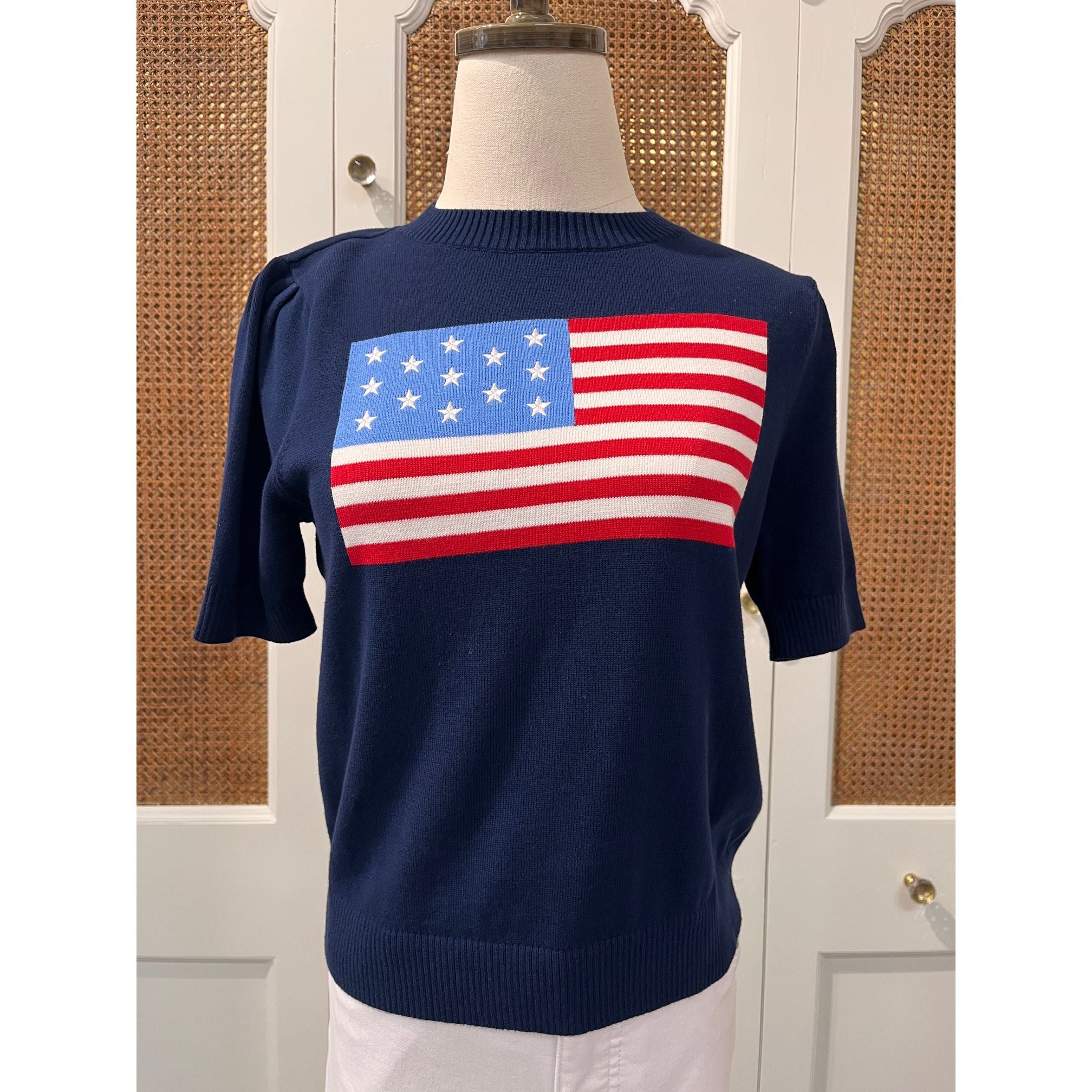 Navy puff sleeve flag sweater by Duffield Lane, featuring a stylish top with bold flag design and puffed sleeves.