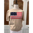 Tan puff sleeve flag sweater top by Duffield Lane, featuring bold flag print and cozy knit fabric.