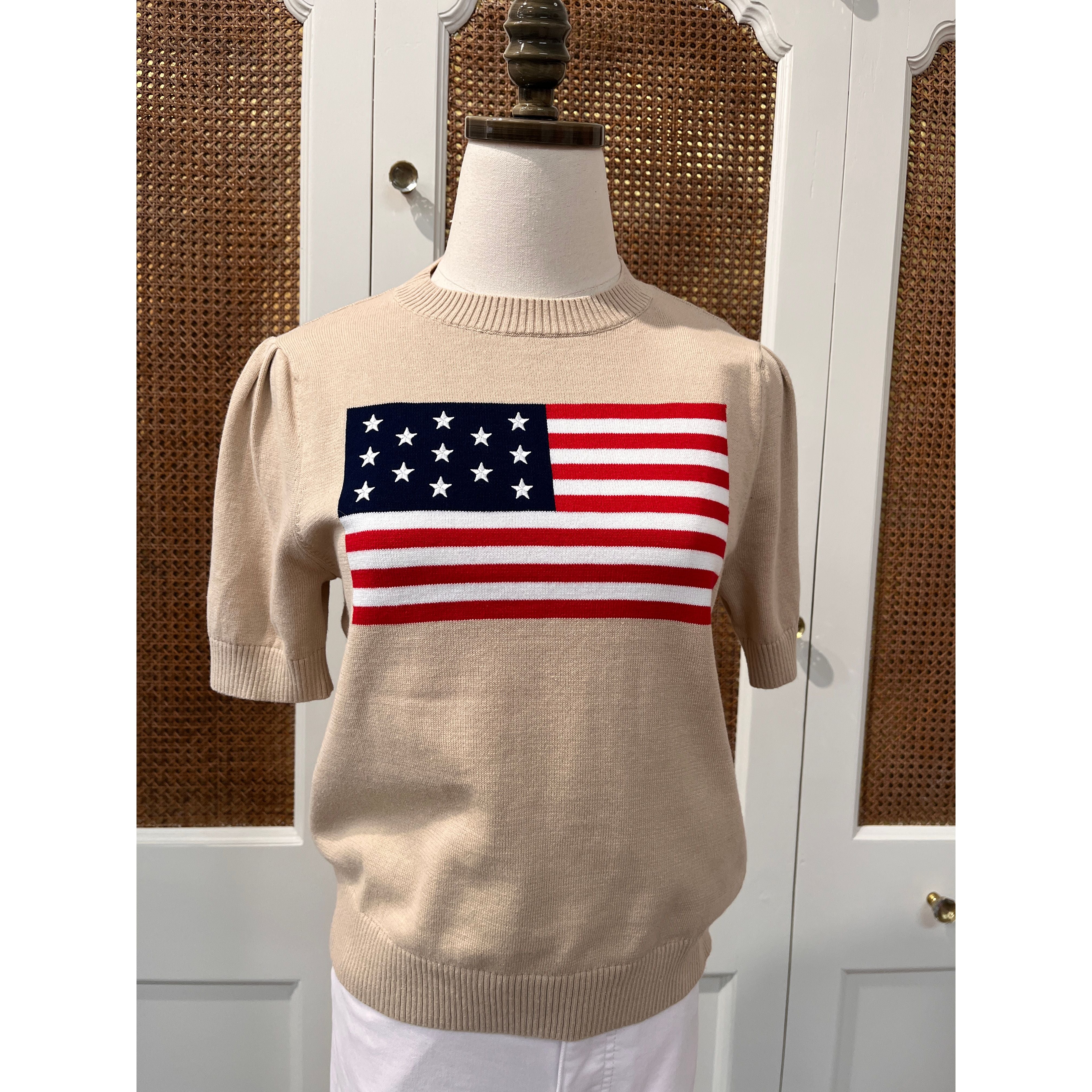 Tan puff sleeve flag sweater top by Duffield Lane, featuring bold flag print and cozy knit fabric.