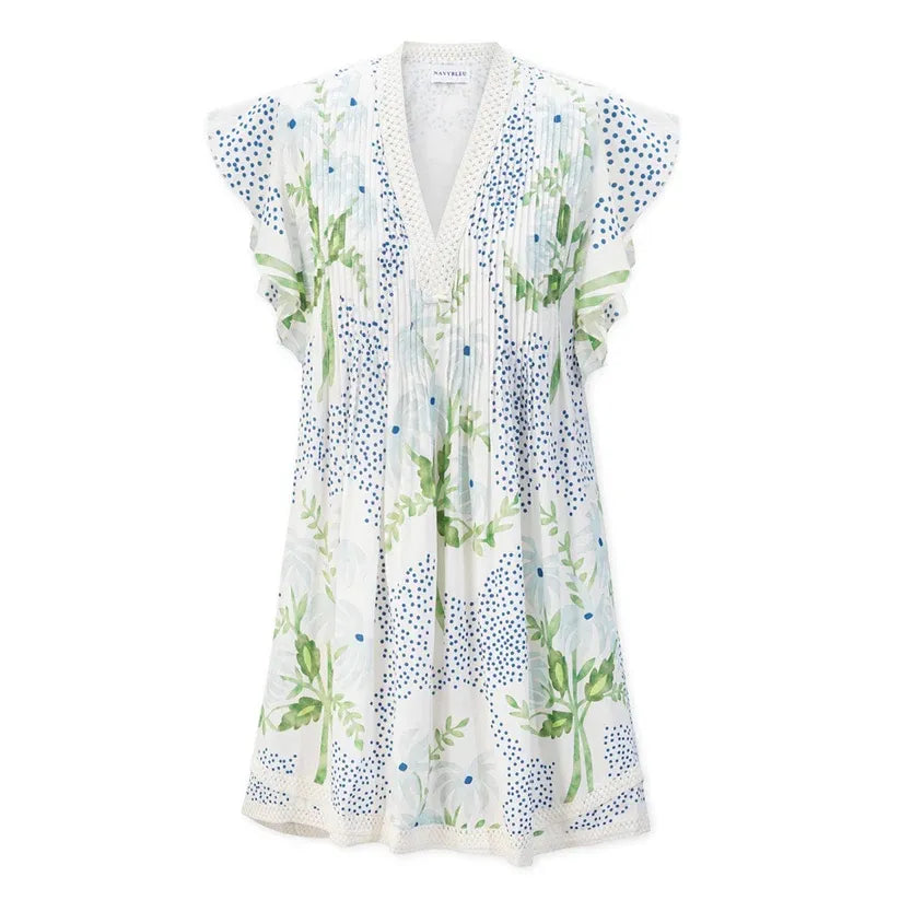 Navy Bleu Eden Dress with blue floral dot pattern, flowing fabric and sleeveless design, displayed on a hanger.