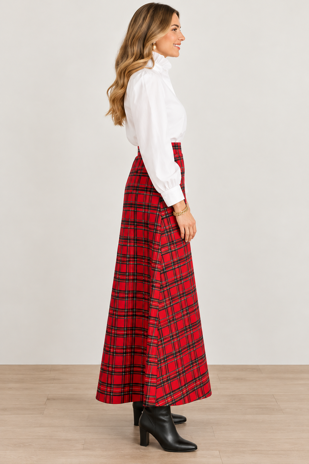 Holly Skirt by Sail to Sable in red and green plaid with an ankle-length flared hem, side view