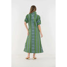 Emily McCarthy Poppy Maxi Forest Jubilee dress in floral jacquard fabric, featuring a flowing silhouette and vibrant green forest-inspired pattern.