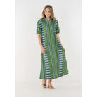 Emily McCarthy Poppy Maxi dress in Forest Jubilee floral print, featuring a flowing silhouette and vibrant colors.