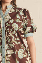 Entro Mabel Top close-up detail showing braided trim on powder blue contrast binding, V-neckline, and button placket
Style#T32339