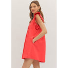 Ruby Dress by Entro — side view, coral red swing mini dress with ruffle sleeves and pockets