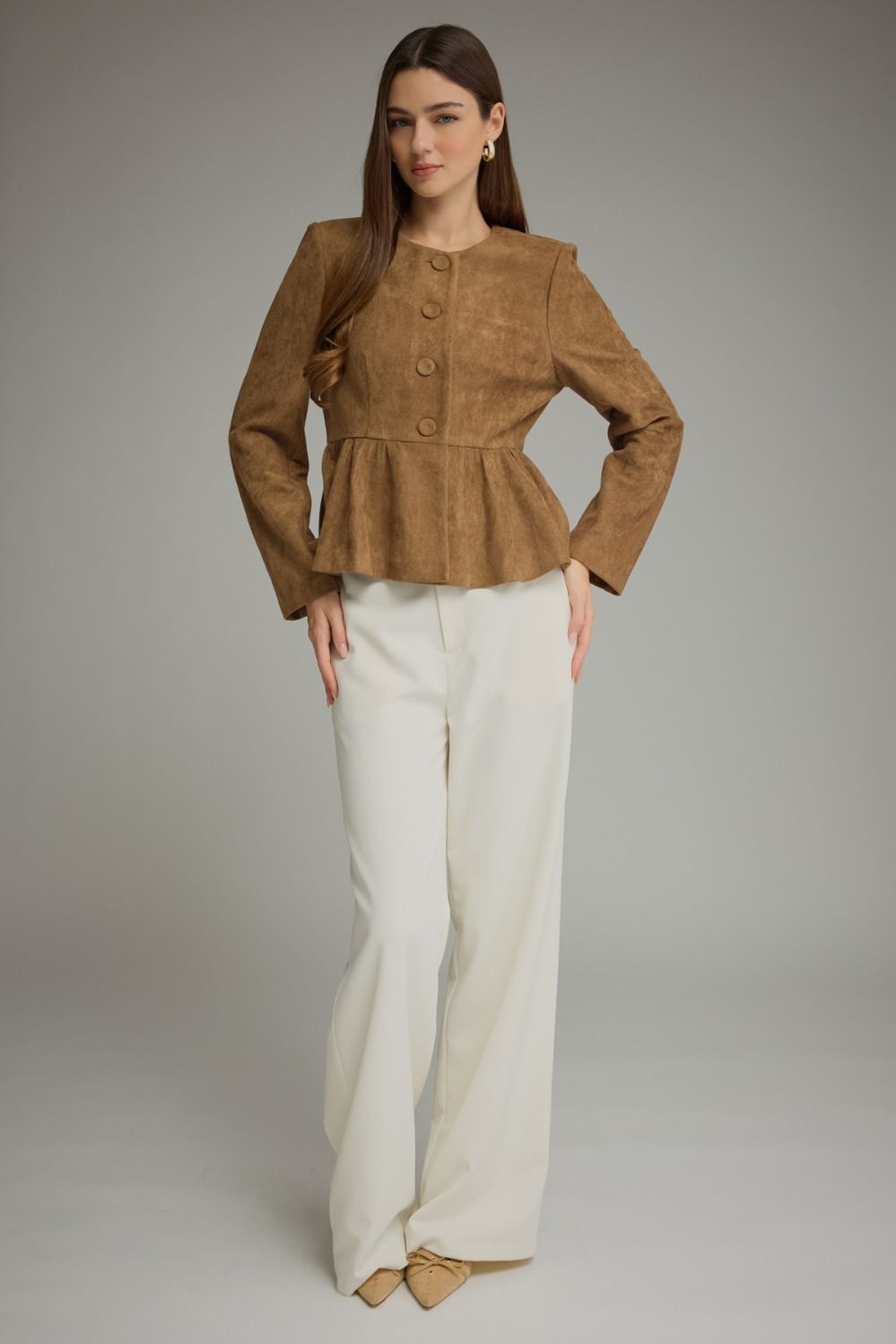 Ellery Top by Entro in mocha brown with long sleeves, covered buttons and a gathered peplum hem, front view on model