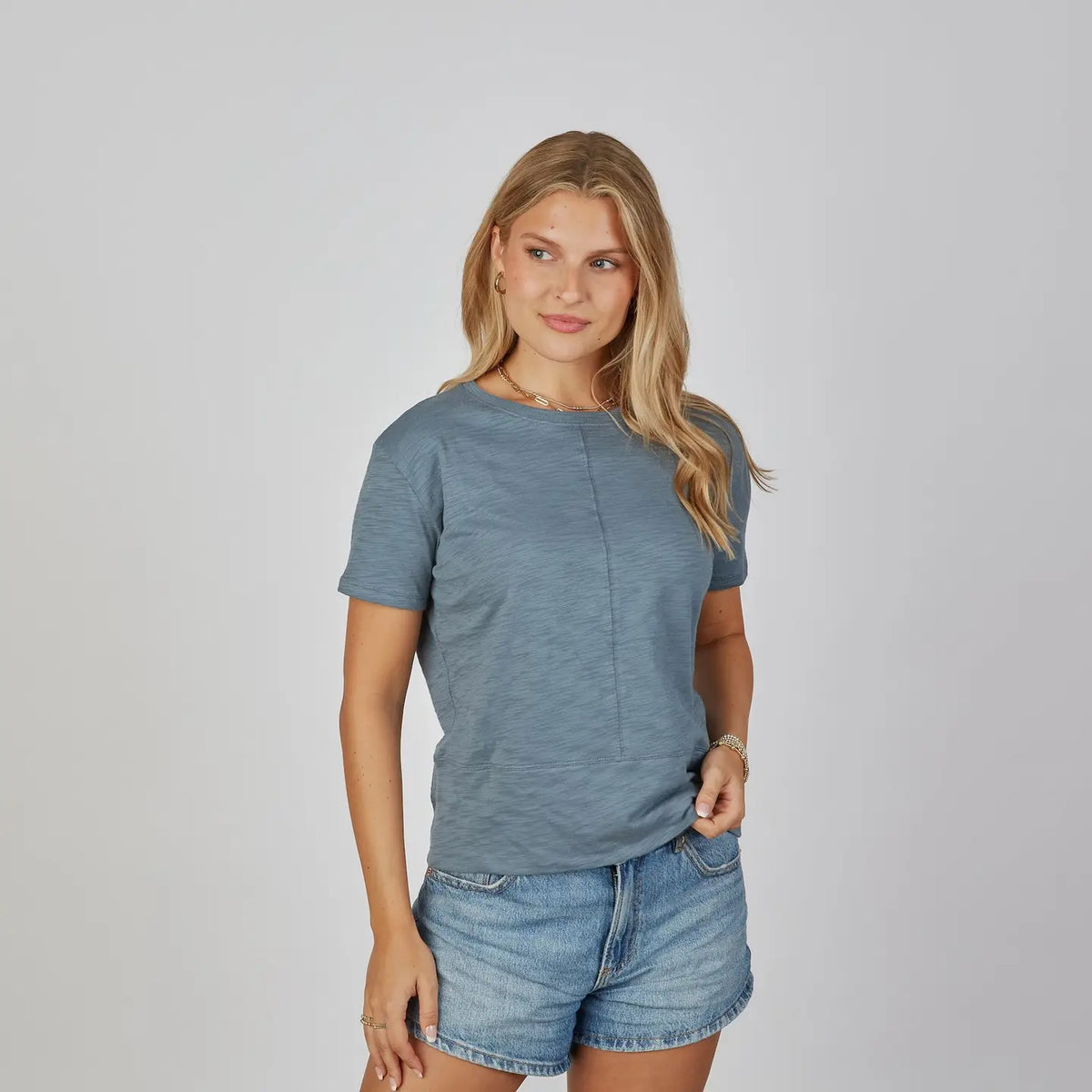 erin gray Celia Perfect Length Tee in denim blue, short sleeve, center seam detail, three-quarter view
