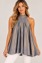 Ainsley Top by Fate in metallic silver-gray with a high halter neck and full draped silhouette, front view.