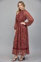 Rosemary Dress by Fate in deep burgundy floral Lurex print, side view, smocked waistband, billowy long sleeves style#FD34143