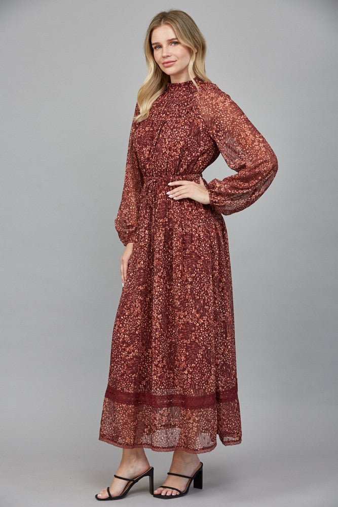 Rosemary Dress by Fate in deep burgundy floral Lurex print, side view, smocked waistband, billowy long sleeves style#FD34143
