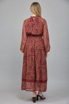 Rosemary Dress by Fate in deep burgundy floral Lurex print, back view, lace hem border detail, maxi length Style#FD34143