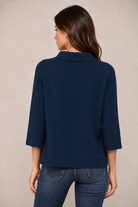 Fate Lucy Sweater in navy, mock neck pullover with 3/4 bell sleeves showing A-line swing hem, three-quarter back view