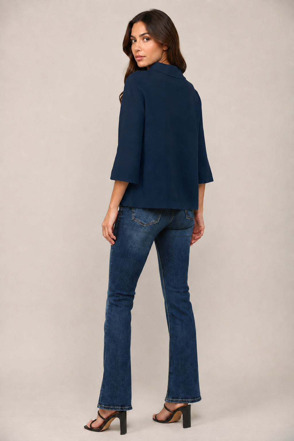 Fate Lucy Sweater in navy, mock neck pullover with 3/4 bell sleeves showing A-line swing hem, three-quarter side-view