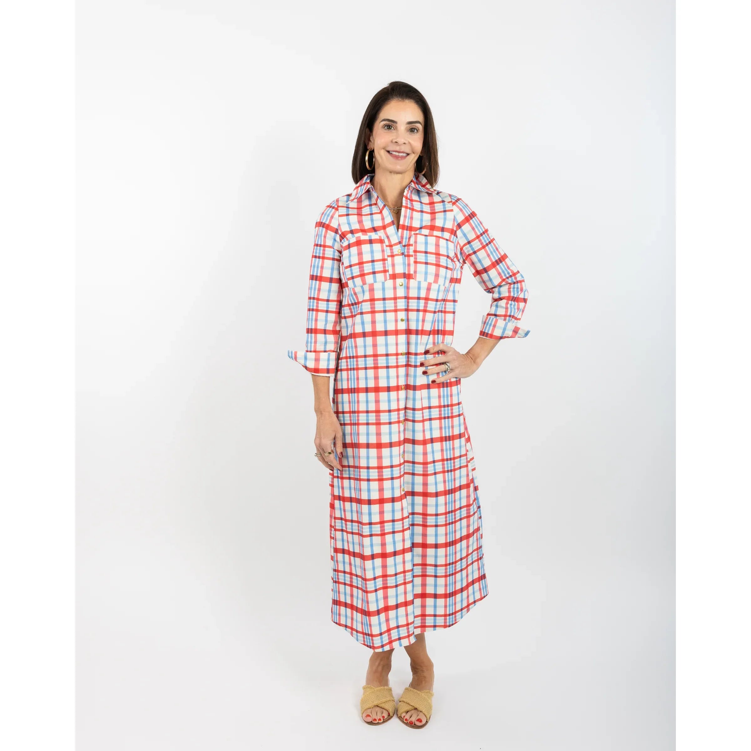Woman wearing a red and white checkered dress on a white background