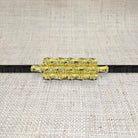 Triple bamboo belt buckle by Garland, featuring natural bamboo design and sturdy metal clasp on a neutral background.